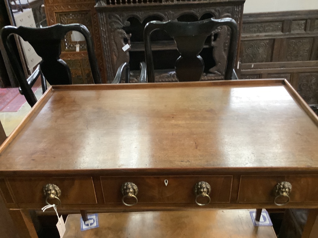 A George III mahogany side table, having three-quarter galleried top over three short drawers on tapered legs, width 95cm depth 51cm height 77cm